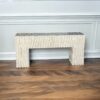 wood console table cream color with reverse painted glass top that resembles a marble top