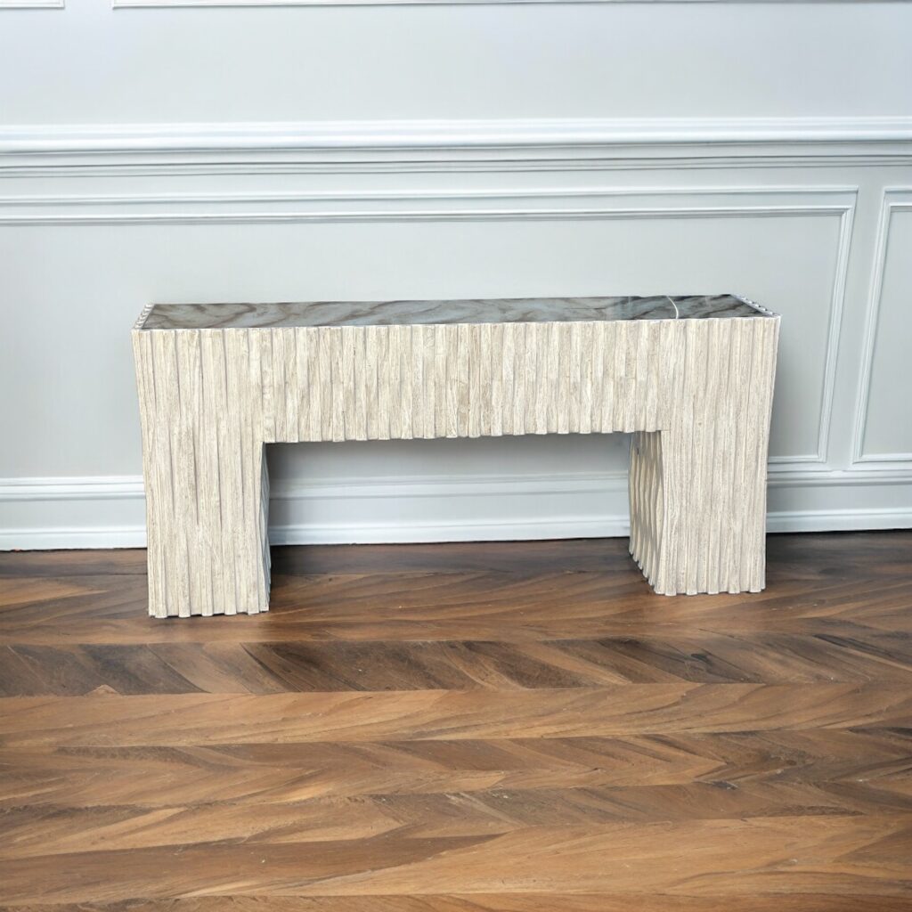 wood console table cream color with reverse painted glass top that resembles a marble top