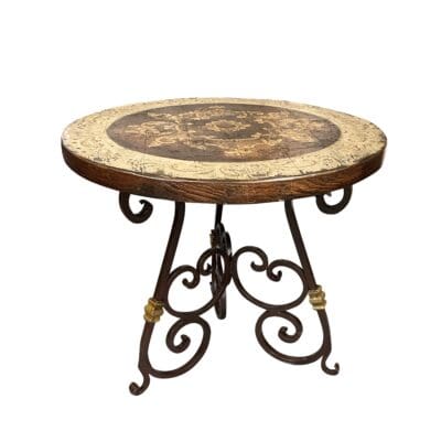 Rustic round side table with hand-painted wood top and wrought iron base, artisan-made.