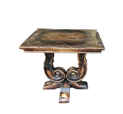 Rustic wood end table with carved scroll legs and aged finish, artisan-made in Peru.