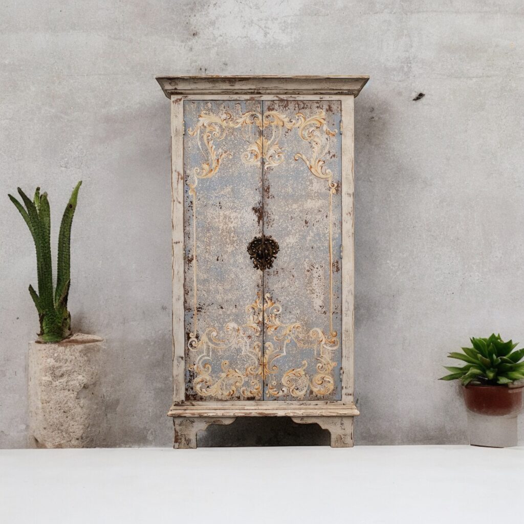 Tuscan Style handcrafted armoire by Peruvian artisans, soft blue hues on the doors with romantic scrolls around the edges , on a white waxed color body, ideal for any bedroom or living room