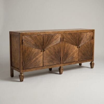 Wooden mid-century cabinet with sunburst veneer doors and small round knobs against a pale wall.
