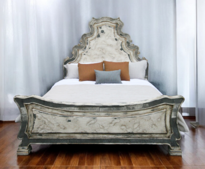 Ornate rustic bed with reverse painted glass on the edges of the headboard and the footboard, off white cream color